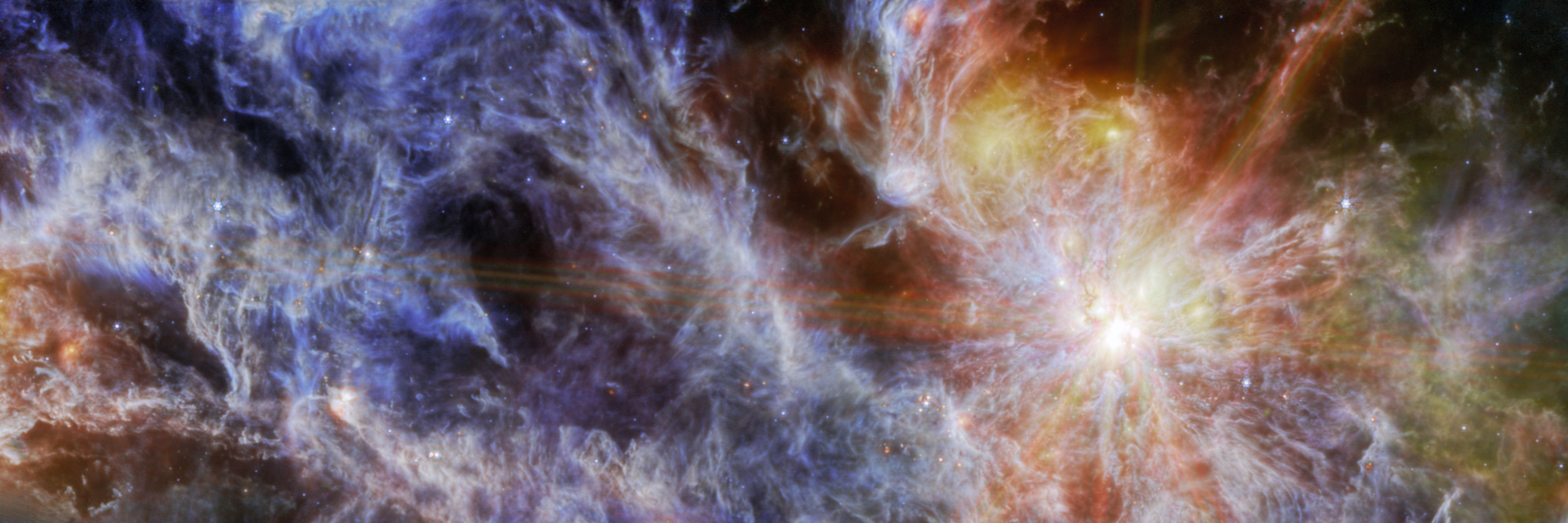 Na ilustracji: Obszar gwiazdotwórczy N79 (S1) w Wielkim Obłoku Magellana - fotografia w podczerwieni (barwy w zakresie λ = 7,7 – 21 μm) uzyskana za pomocą Teleskopu Webba i instrumentu MIRI. Widok został inaczej skadrowany niż ilustracja tytułowa, ale zachowano orientację. Źródło: NASA/ESA/CSA/M. Meixner