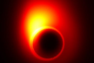 Obraz stworzony dzięki symulacjom komputerowym. Pokazuje on, jak bardzo silna grawitacja w M87 zakrzywia powstającą tu strukturę dżetu w pobliżu horyzontu zdarzeń. Część promieniowania tego dżetu zagina się w rodzaj pierścienia nazywanego "cieniem" czarnej dziury. (Źródło: Avery E. Broderick (Perimeter Institute & University of Waterloo))